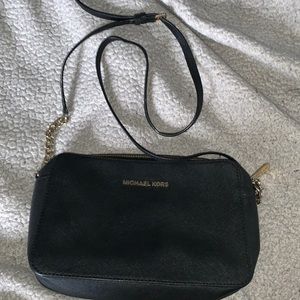 Michael Kors black crossbody bag with buckle strap